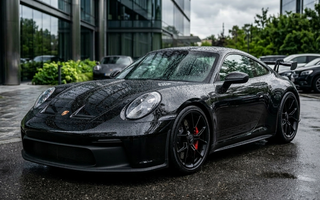 shiny black ceramic coated car with water beads 