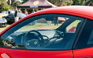 close-up of a shiny red car with streak free clean windows