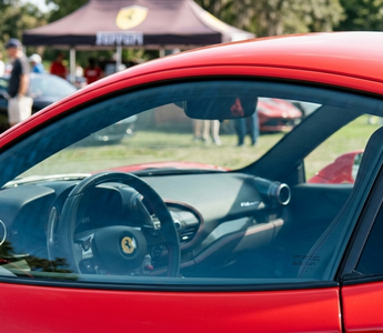 close-up of a shiny red car with streak free clean windows