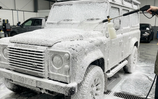 land rover defender being cleaned with car snow foam